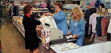 The new Woolworths store in Basingstoke, which relocated into the town's new shopping centre in 1971, was pictured to celebrate "D" day (decimalisation) in February 1971. This picture shows the cash wrap desk on the Upper Floor adjacent to the Clothing Department.
