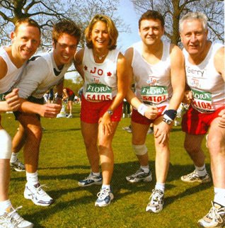 Classless culture in action as the Chief Executive joins four colleagues who successfully completed the London Marathon in 2003 (Left to right Andrew Mann, Ed(ward) Preston, Joanna Mills, CEO Trevor Bish-Jones and Gerry McEvoy)