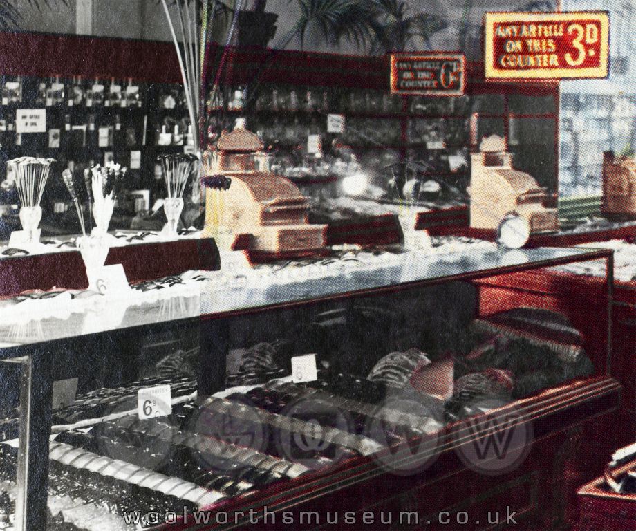 A close up of the display cabinets at the front of the store, with the confectionery and drinks department on the wall behind