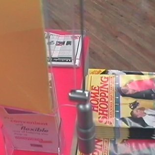 A self-service display of Back to School Home Shopping Catalogues in Summer 1998