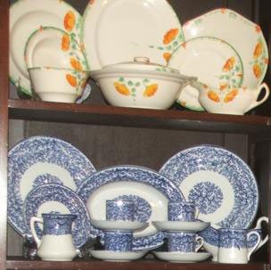 Woolworths Ivory Pattern China - a cream coloured base with a green stripe and orange flowers (top) and blue of white 'Fibre' pattern (bottom); both were immensely popular in the 1910s and 1920s - and were manufactured for Woolworths in the potteries of Burslem and Stoke-on-Trent