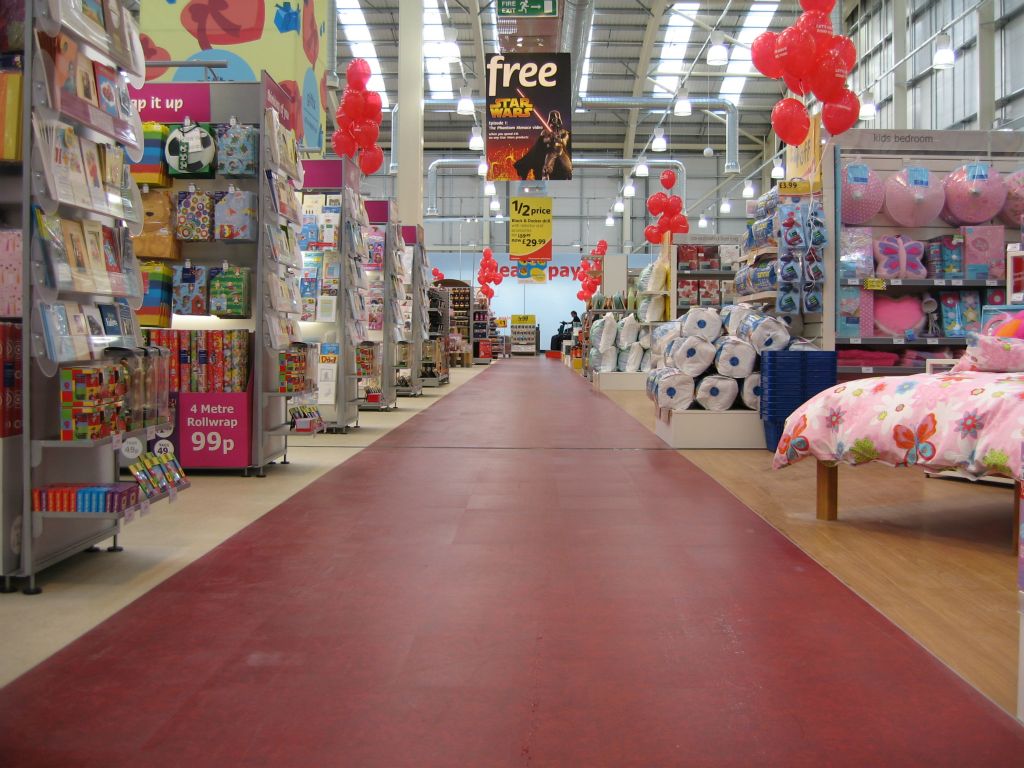 Hardly sweating the space, the red walkway in some Woolworths out-of-town stores was HUGE and did a complete circuit of the store
