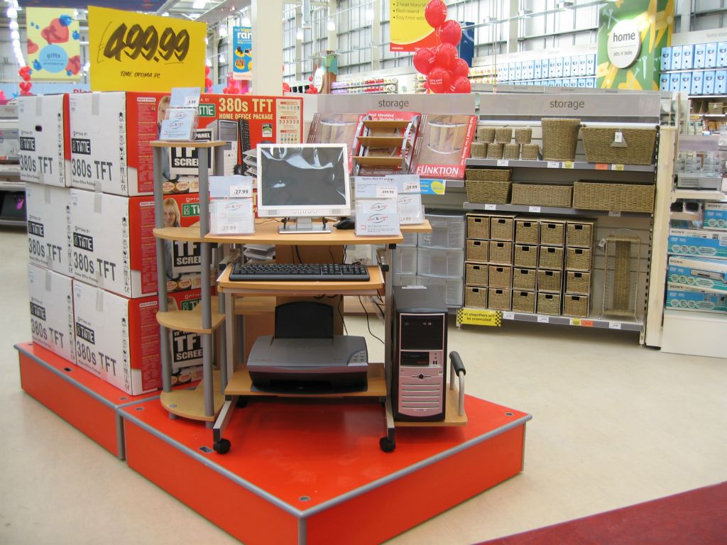 A plinth display of personal computers with TFT screens at an out-of-town Woolworths store in 2005