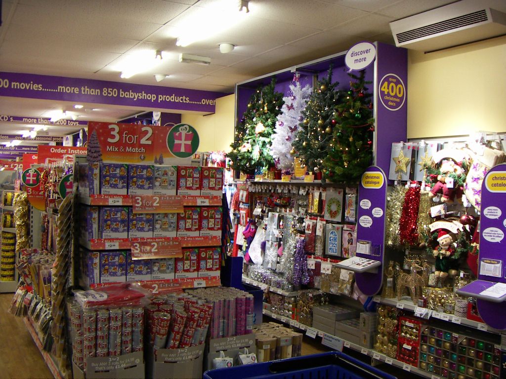 An abundance of Christmas cards, wrapping paper, Xmas Trees and Wreaths on display in the Kingswood Woolworths (2005)