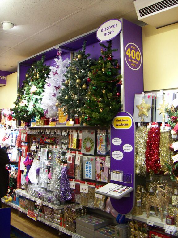 A brightly decorated beacon containing five different Christmas Trees, helping shoppers to find the Christmas ranges at the Kingswood Woolworths (5 November 2005)