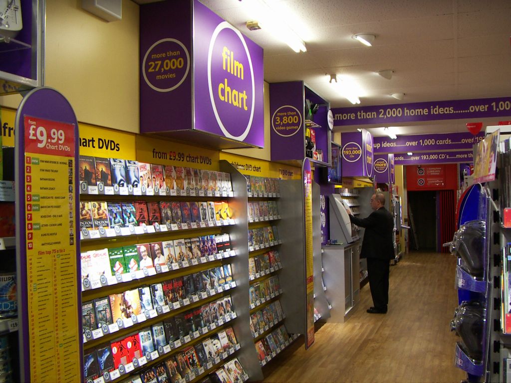 A whole aisle of entertainment products, stretching from the centre of the Kingswood store to the back. The display includes an IBM/Retec touch-screen ordering kiosk (2005)