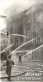 The large F. W. Woolworth in High Street Belfast, ablaze after a bombing incident in Northern Ireland's troubles in April 1974. The picture was used as a first day cover celebrating the achievements of the Northern Ireland Fire Service later the same year