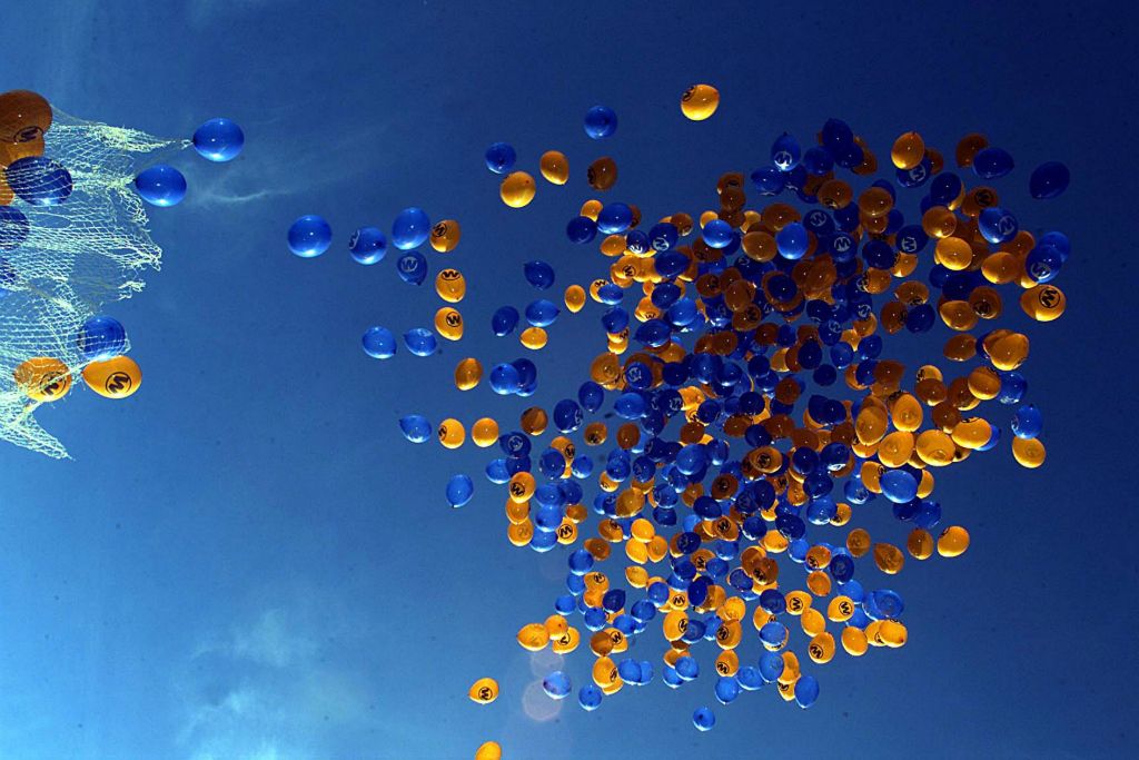 Filling the sky, bright orange and blue balloons to mark the launch of Big W Bradford