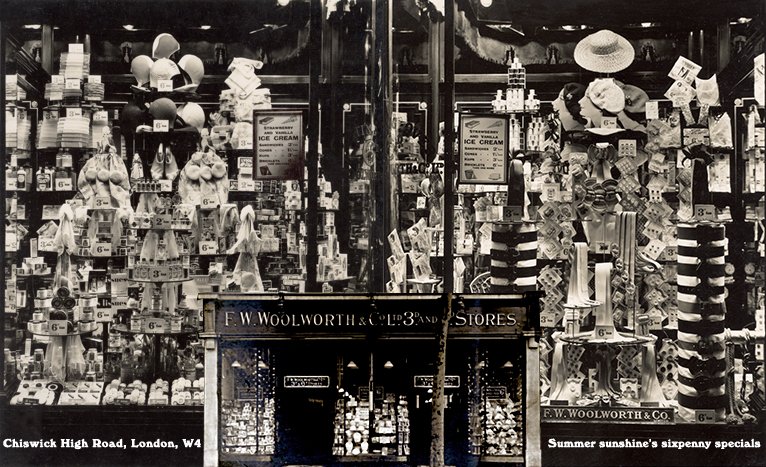 Bold features of sixpenny items for the summer sunshine, in the windows of the F.W. Woolworth store in Chiswick High Road in West London in 1937