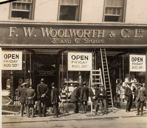 The Construction Team look-on as the District Manager admires his new F. W. Woolworth shop, due to open the next day