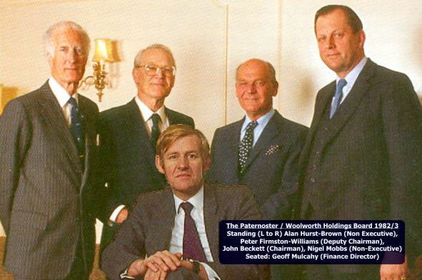 The consortium behind the takeover of the British and Irish Woolworth Company, which was christened Paternoster Stores and later renamed Woolworth Holdings Ltd. Standing, left to right are Alan Hurst-Brown,  Peter Firmston-Williams, John Beckett (Chairman) and Nigel Mobbs, with Finance Director Geoff Mulcahy sitting in the foreground