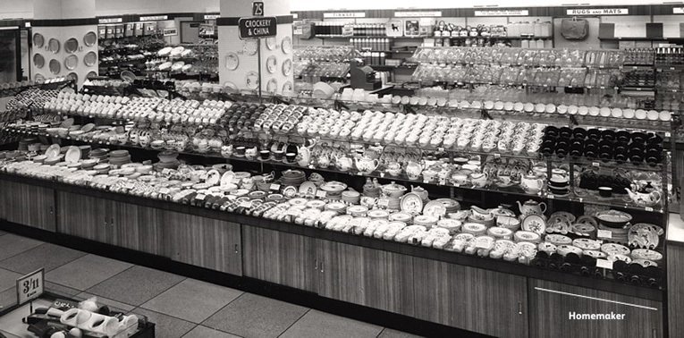 Island counters loaded with china and glassware in Woolworths in the 1950s. In the foreground at the right is a section filled with a variety of pieces from Enid Seeney's legendary Homemaker pattern