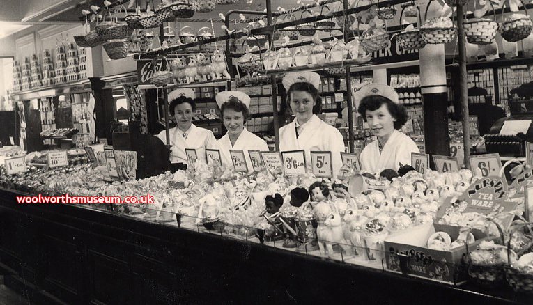 The staff of Woolworth Pontypool in Wales show off their spectacular display of dolls, nursery teaware and Easter Bunnies in 1951
