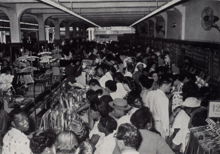 Opening day at Woolworths in Kingston Jamaica in 1954. The salesfloor was packed out with customers and the store was run off its feet!