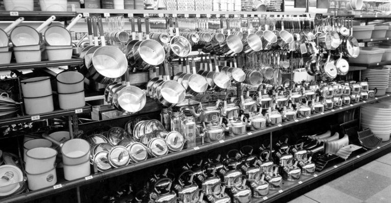 More saucepans, made from modern materials in the mid 1950s.  The older enamel-type pans are on the left, while newer lightweight aluminium designs were given pride of place by 1953.