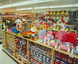 The selection of toys and games in a small, local High Street Woolworths store in the 1980s