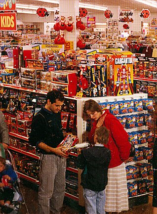 A family choose toys in a Woolworths store in the late 1980s
