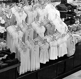 Hanging garment displays like this started to appear in Woolworth stores from 1950. Click the image for a larger version with more detail in a new window