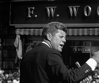 US President John F. Kennedy, speaking outside an F. W. Woolworth store