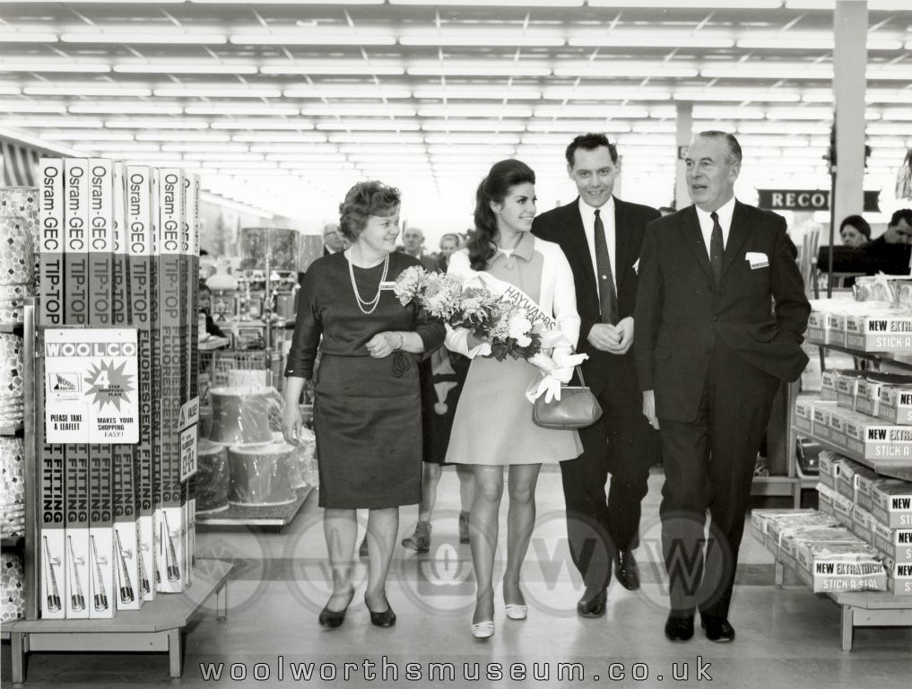 Staff Manageress Mrs D. Lee-Hanson, General Manager John G. Dodds and Woolco Buying Manager Sid (A.S.) Stafford accompany Kathleen Winstanley, 1968's Miss United Kingdom, on a whistlestop tour of the huge Woolco Department Store 